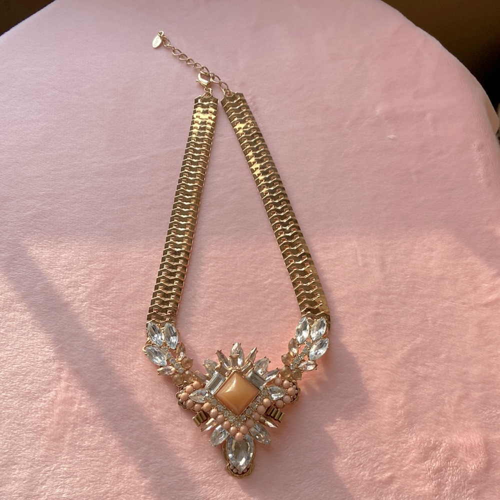 Gold and peach colored fashion necklace